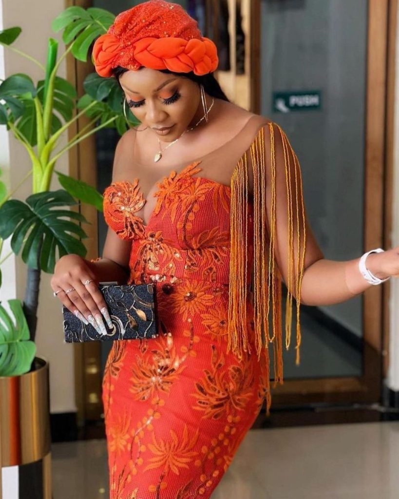 Burnt orange lace aso ebi styles are the current rave for weddings